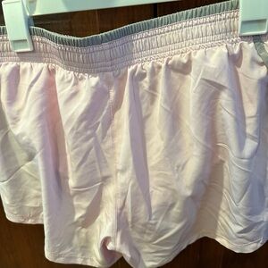 Nike women’s shorts size L elastic waist light pink NWT